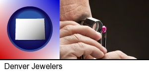 Denver, Colorado - a jeweler examining a jewel