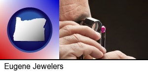 Eugene, Oregon - a jeweler examining a jewel