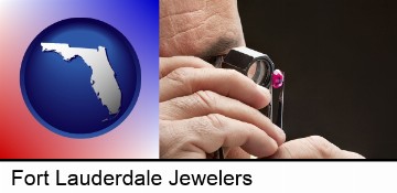 a jeweler examining a jewel in Fort Lauderdale, FL