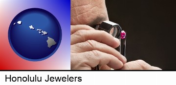 a jeweler examining a jewel in Honolulu, HI