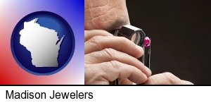 Madison, Wisconsin - a jeweler examining a jewel