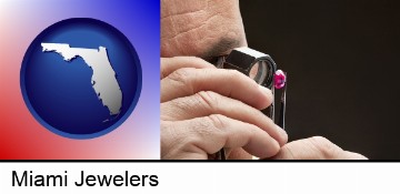 a jeweler examining a jewel in Miami, FL