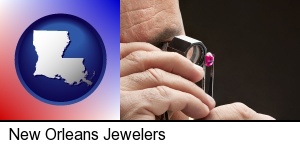 New Orleans, Louisiana - a jeweler examining a jewel