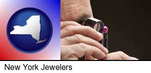 New York, New York - a jeweler examining a jewel