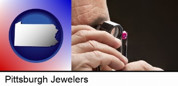 a jeweler examining a jewel in Pittsburgh, PA