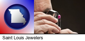 Saint Louis, Missouri - a jeweler examining a jewel