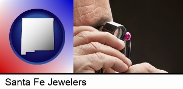 a jeweler examining a jewel in Santa Fe, NM