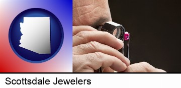 a jeweler examining a jewel in Scottsdale, AZ