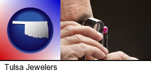 a jeweler examining a jewel in Tulsa, OK