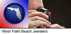 a jeweler examining a jewel in West Palm Beach, FL