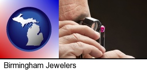 a jeweler examining a jewel in Birmingham, MI
