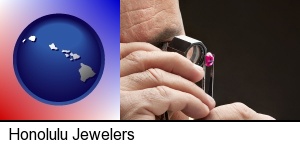 Honolulu, Hawaii - a jeweler examining a jewel