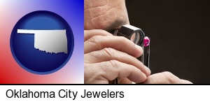 Oklahoma City, Oklahoma - a jeweler examining a jewel