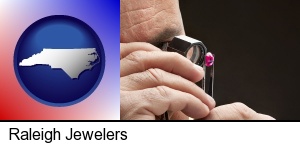 Raleigh, North Carolina - a jeweler examining a jewel