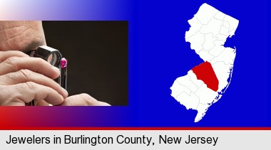 a jeweler examining a jewel; Burlington County highlighted in red on a map